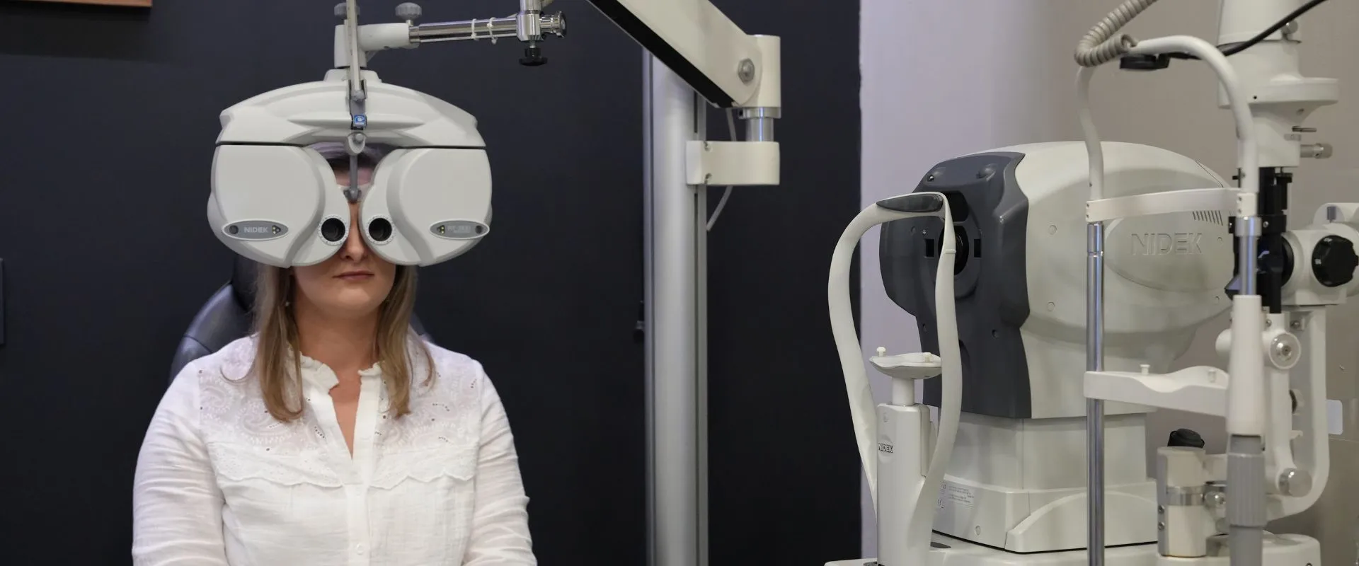 Binocular vision testing with a phoropter at Reza Ferreira Boutique Optometrists