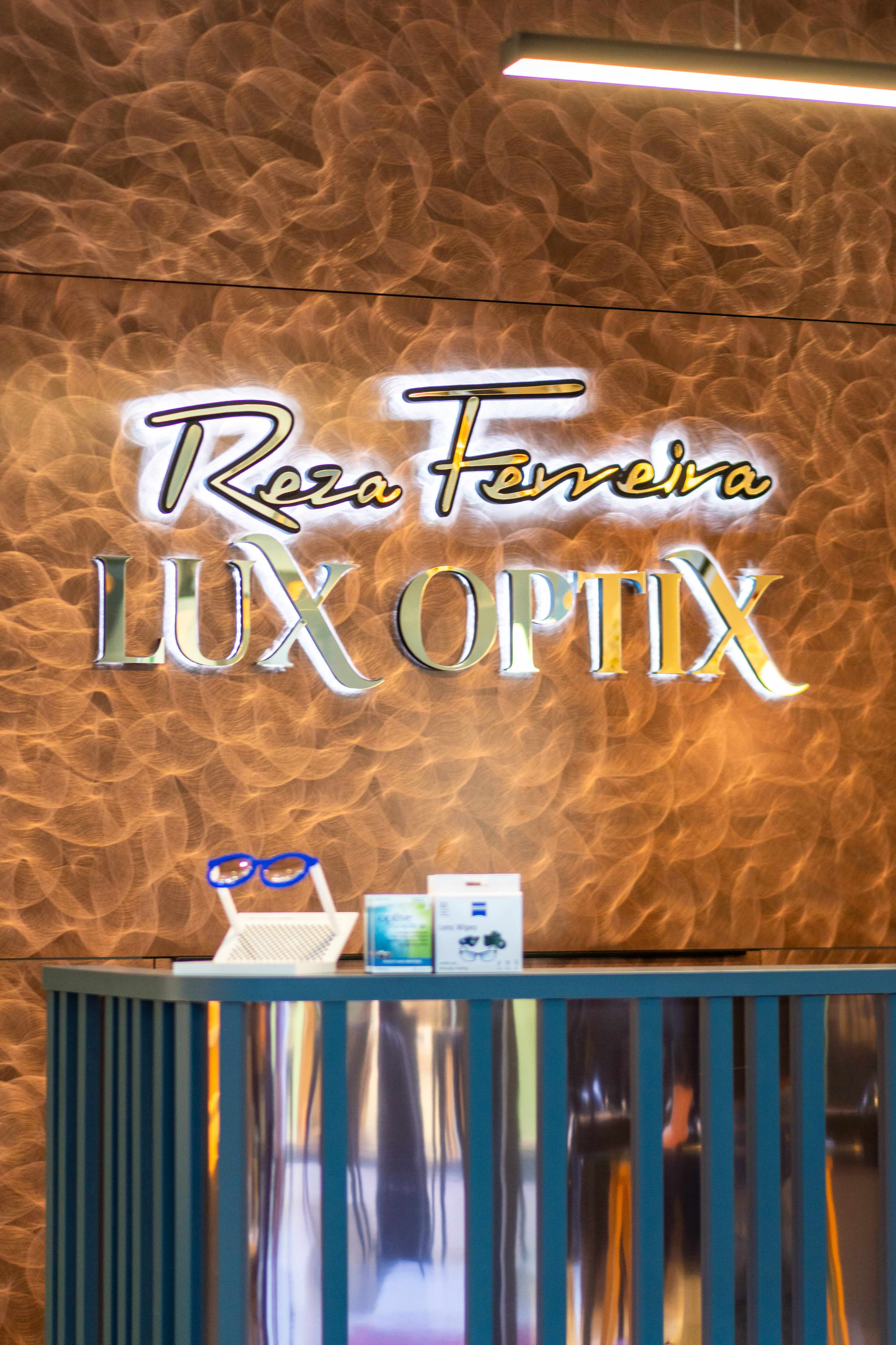 Reza Ferreira LuxOptix luxury boutique optometrist signage at the Parelberg Shopping Centre reception