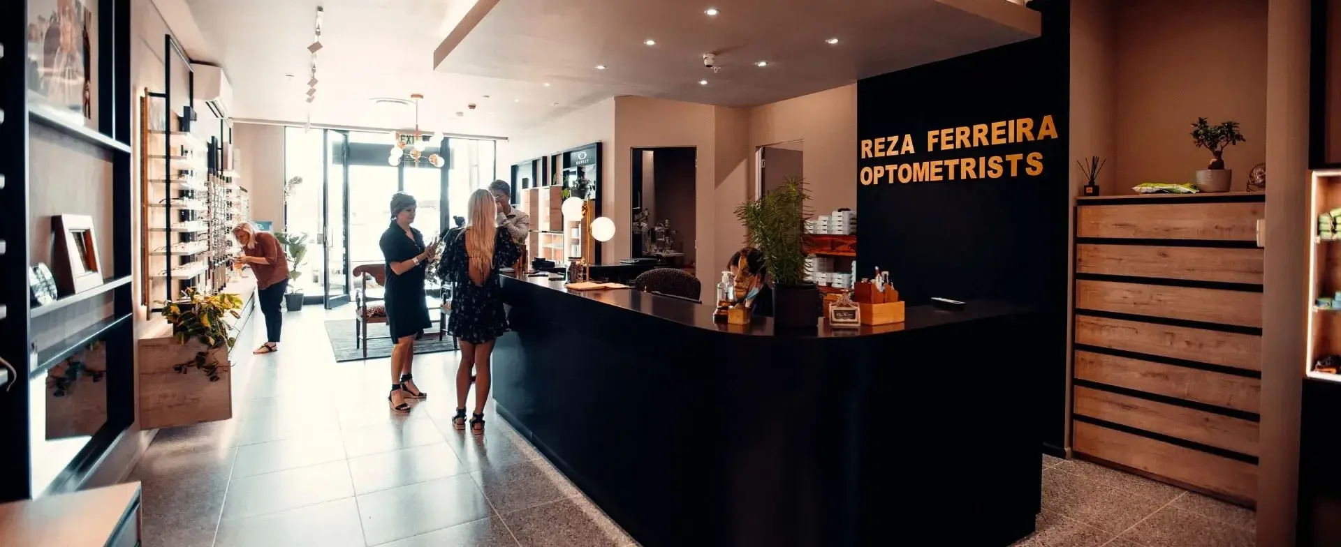 Optometrist Paarl practice interior at Drakenstein Mall showing the reception counter and eyewear displays at Reza Ferreira Boutique Optometrists