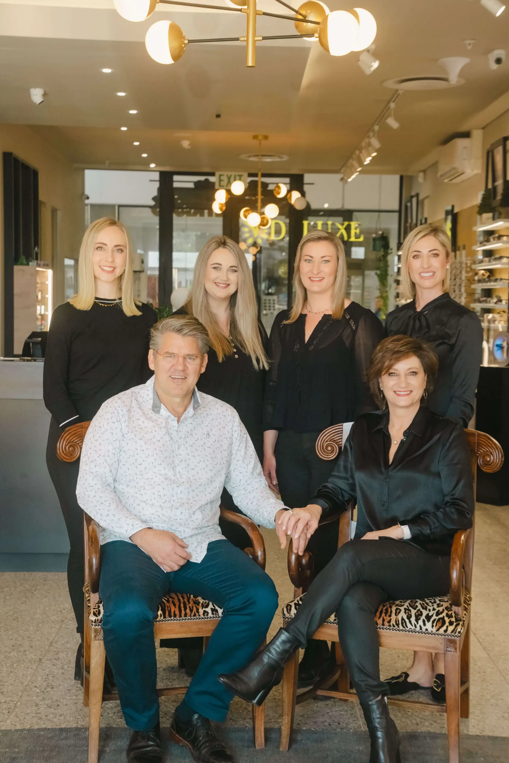 Reza Ferreira Optometrist team seated together inside the Paarl practice