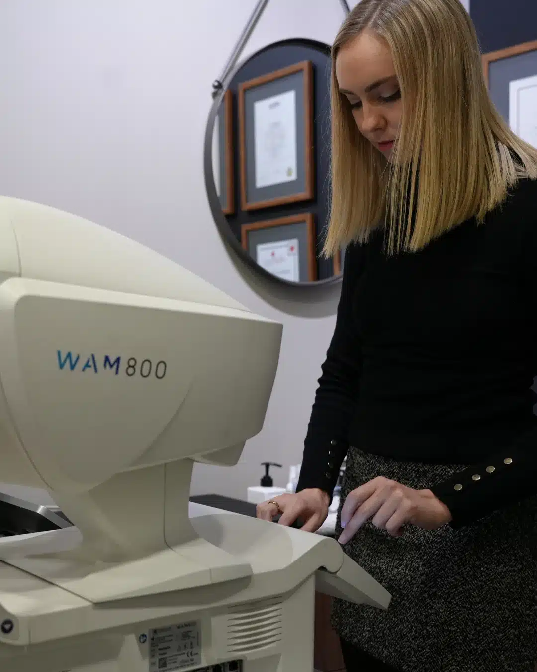 Crystalvue retinal imaging device displaying a detailed view of the retina on a digital tablet at Reza Ferreira Optometrist