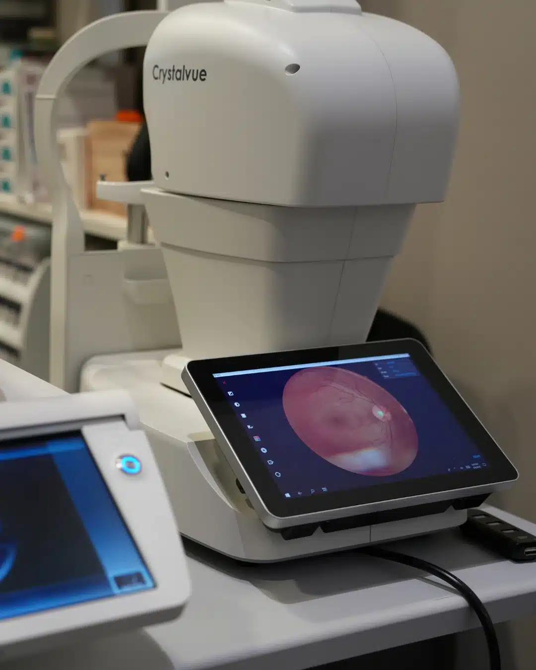 Optometrist operating a WAM800 wavefront auto-refractor in the consulting room at Reza Ferreira Optometrist